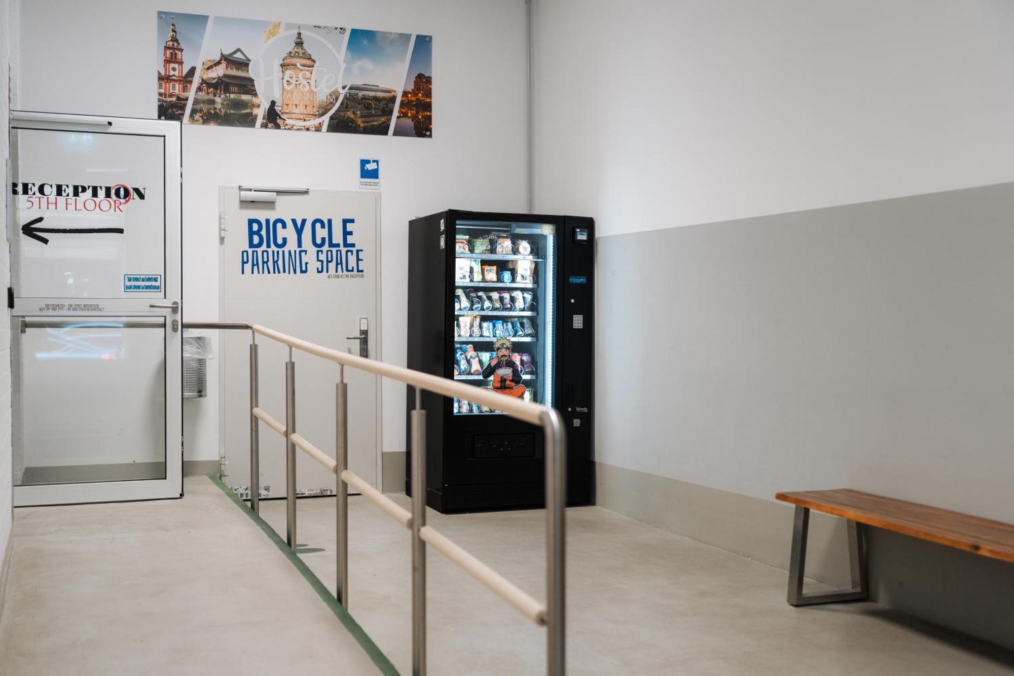 Hostel Мангейм Экстерьер фото A vending machine in a bicycle parking garage